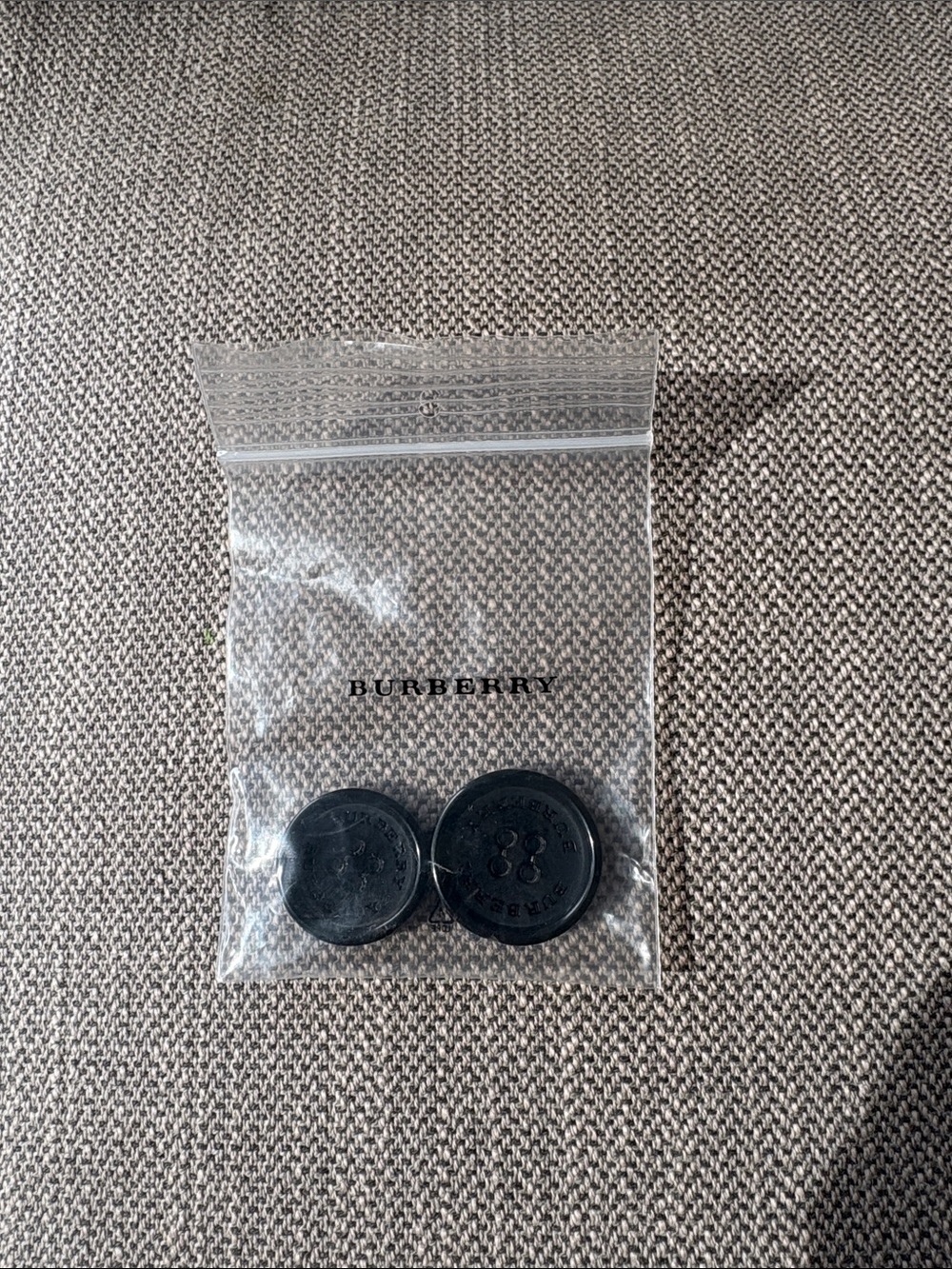 Two Black Burberry Buttons